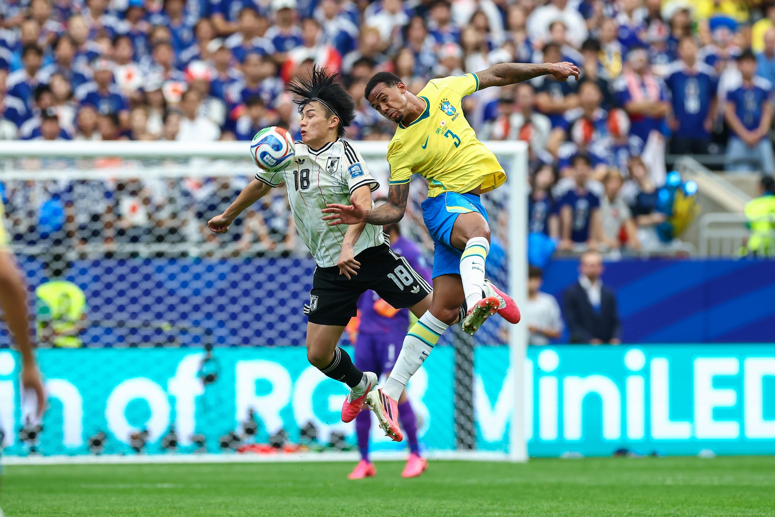 Ayase Ueda (18) and Gabriel Magalhães (3) duel in the air . Japan vs Brazil, 2026 World Cup, Dallas Stadium, June 27, 2026. (Matt Visinsky, 3rd Degree)