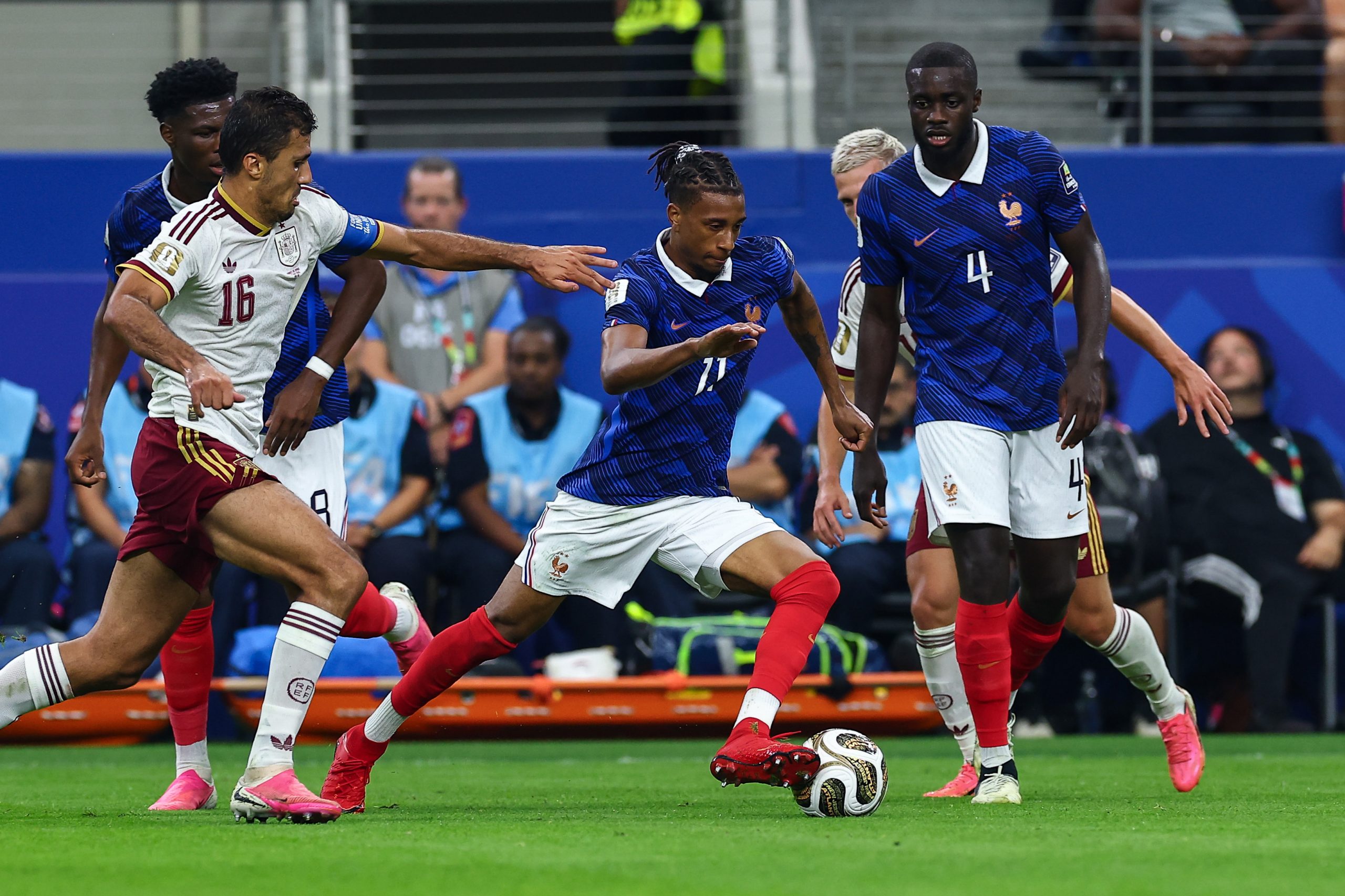 Michael Olise (11) escapes from Rodri (16). France vs Spain, 2026 World Cup, Dallas Stadium, July 14, 2026. (Matt Visinsky, 3rd Degree)