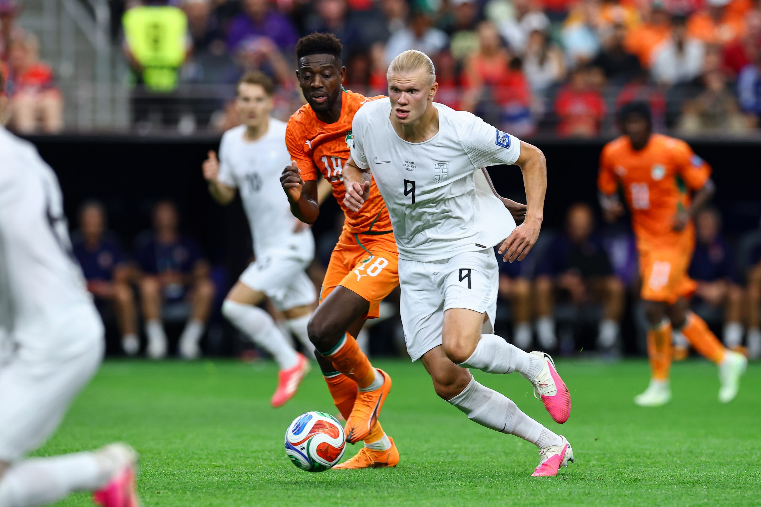 Erling Haaland (9) charges past Ibrahim Sangaré (18). Norway vs Côte d'Ivoire, 2026 World Cup, Dallas Stadium, June 27, 2026. (Matt Visinsky, 3rd Degree)