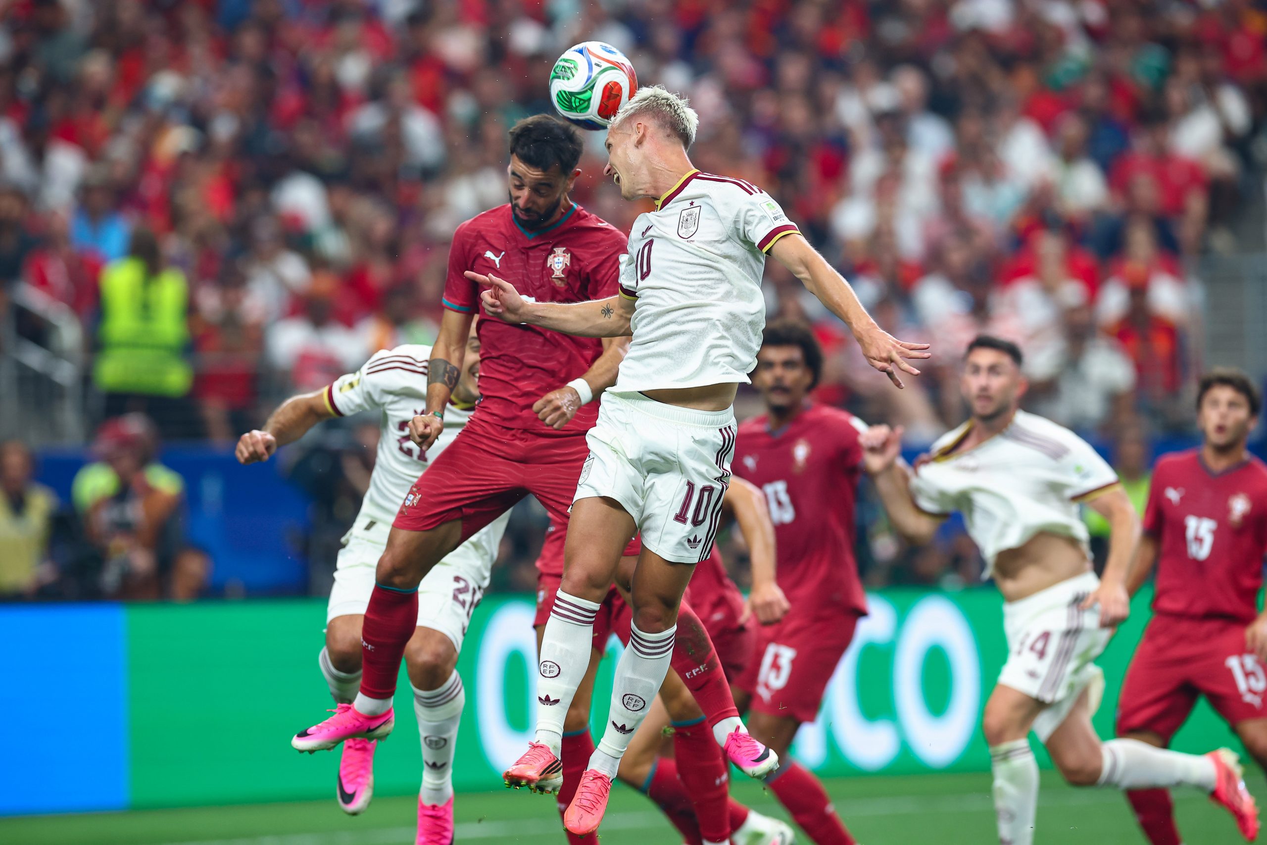 Dani Olmo (10) and Bruno Fernandes (9) battle for a header. Portugal vs Spain, 2026 World Cup, Dallas Stadium, June 27, 2026. (Matt Visinsky, 3rd Degree)
