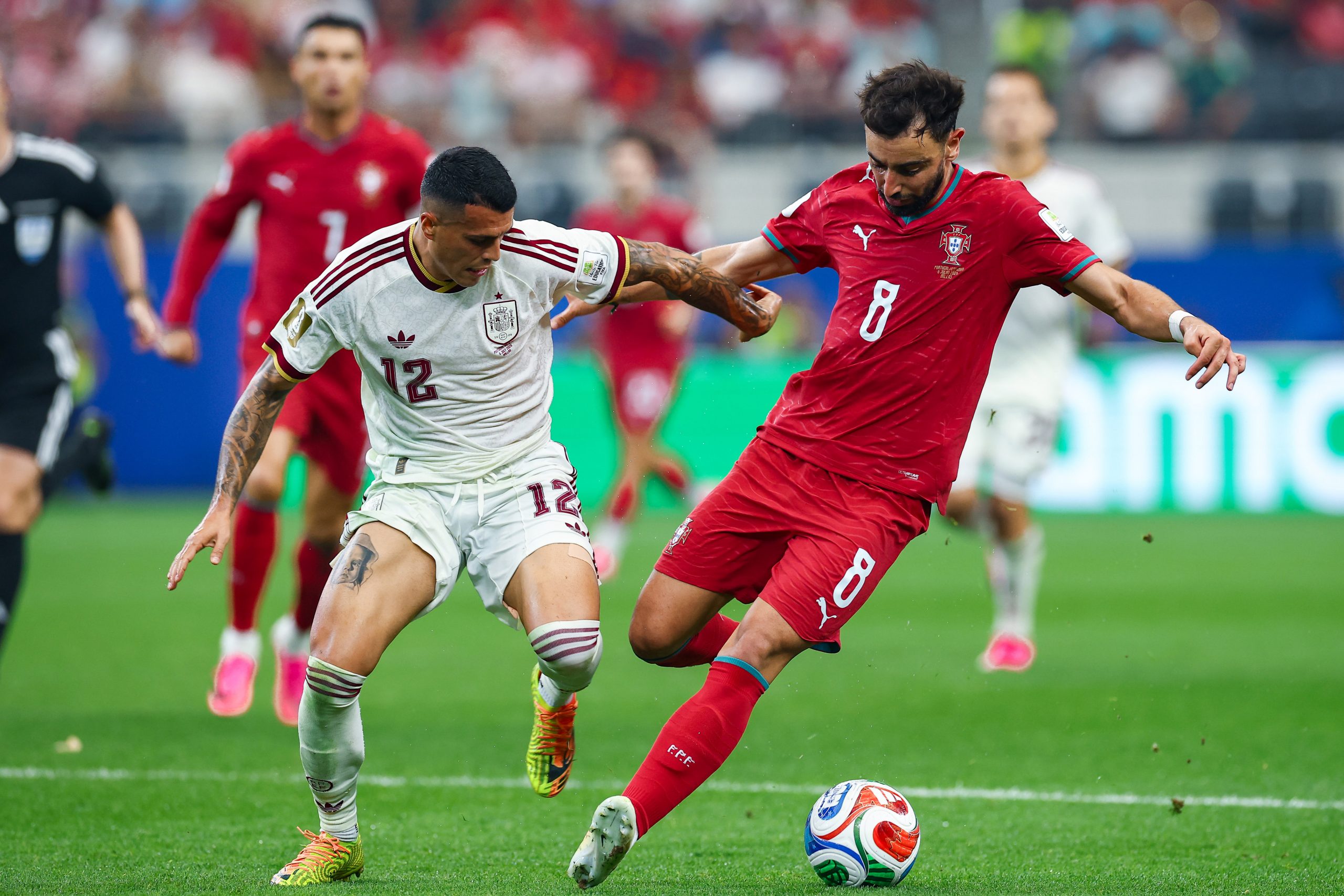 Pedro Porro (12) and Bruno Fernandes (8) duel. Portugal vs Spain, 2026 World Cup, Dallas Stadium, June 27, 2026. (Matt Visinsky, 3rd Degree)