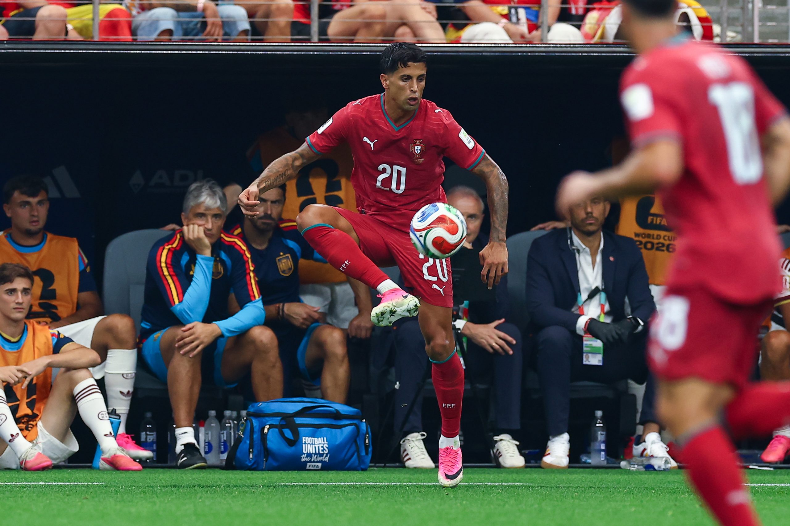 João Cancelo (20) settles the ball in front of the Spanish bench . Portugal vs Spain, 2026 World Cup, Dallas Stadium, June 27, 2026. (Matt Visinsky, 3rd Degree)