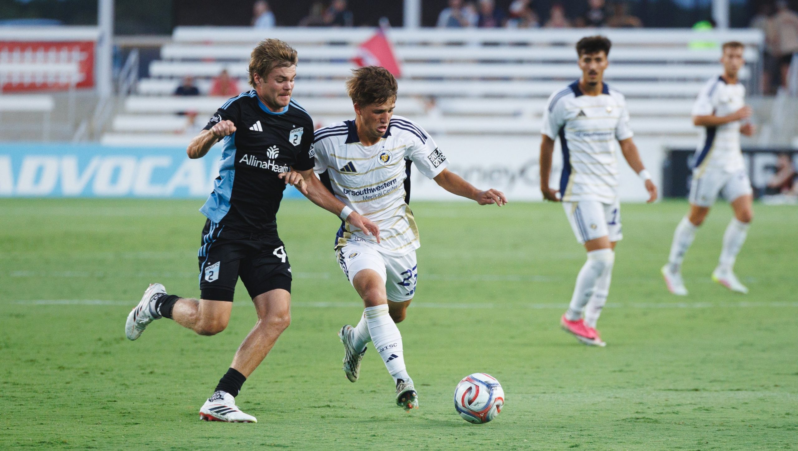 Caleb Swann (27) fights off a Loons 2 defender. North Texas SC vs Minnesota United FC 2, August 22, 2026. (Cort Letcher, 3rd Degree)