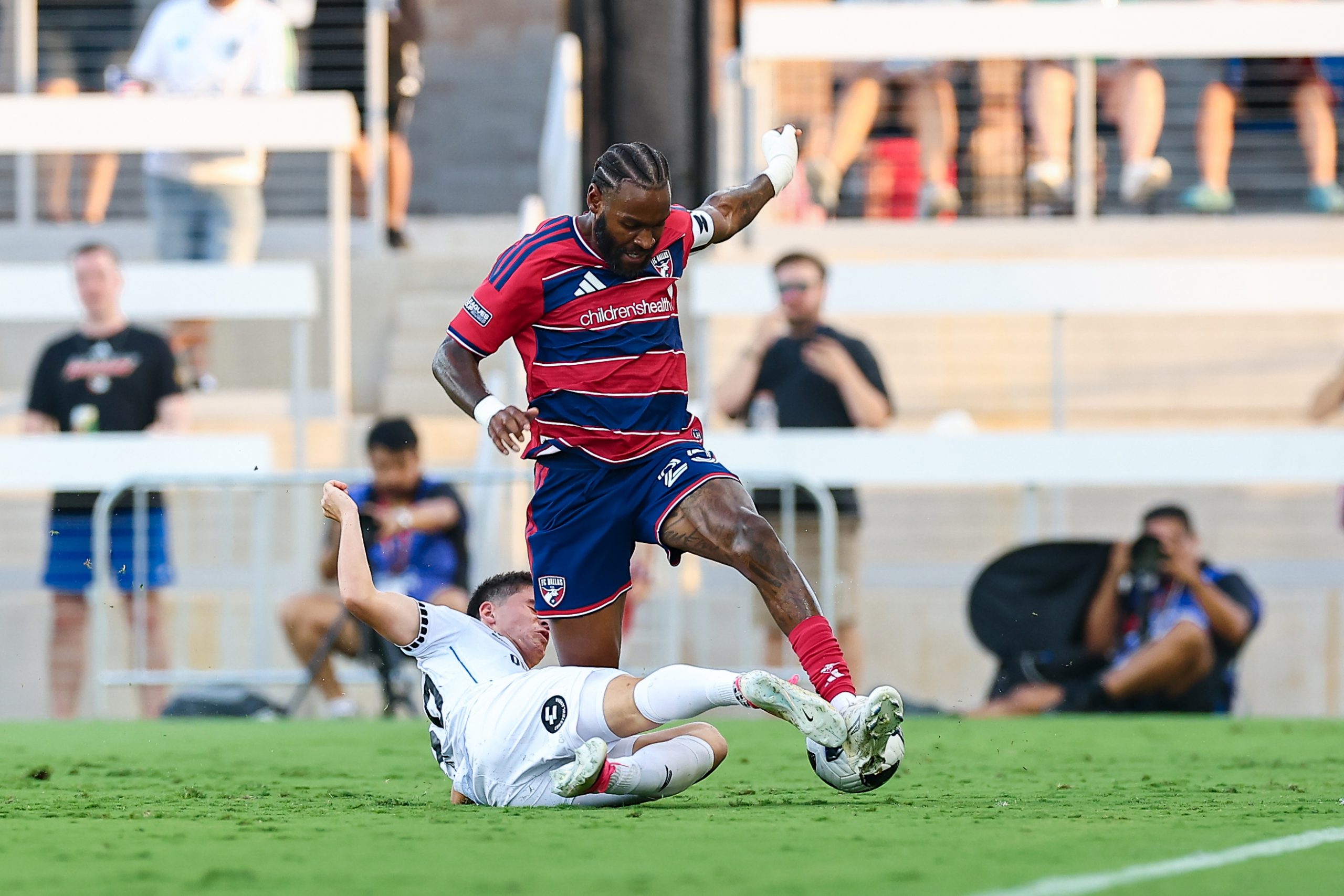 Sebastien Ibeagha (25) fights through a tackle against Querétaro FC in Leagues Cup Game One, August 5, 2026. (Matt Visinsky, 3rd Degree)