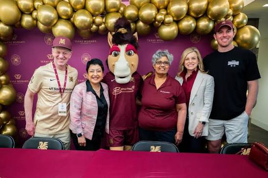 TWU's Pushkala Raman, the college's senior associate dean of academic affairs (3rd from right), along with Trinity founders Charlie & Jim Neil and mascot Boots - via TWU's Instagram 