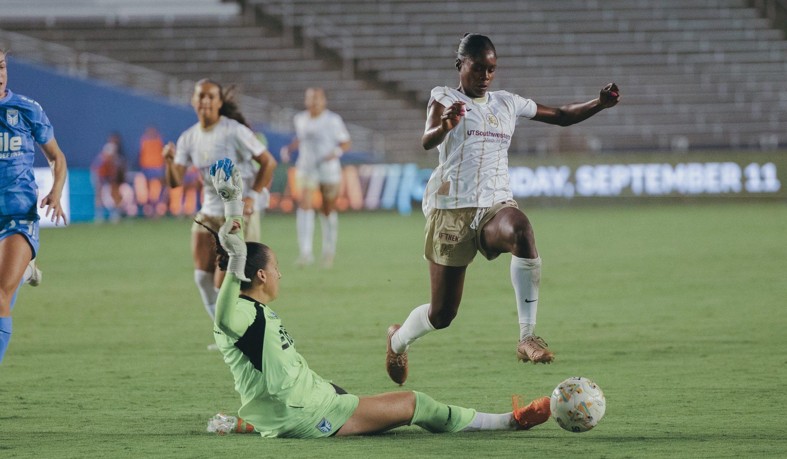 Jasmine Hamid (17) hurdles the diving DC keeper as Dallas Trinity takes on DC Power, September 13, 2026. (Beth Spicer, 3rd Degree)