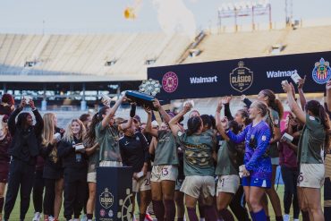 Dallas Trinity lifts the 2026 State Fair Clásico trophy after beating Chivas Femenil 3-2, October 17. 2026. (Beth Spicer, 3rd Degree)